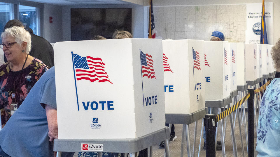 Voters cast ballots in election office