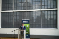 The Pittsburgh skyline is silhouetted in the shades of windows at the Energy Innovation Center as Andrew Wheeler, the EPA Administrator, speaks about the rollback of the 2016 methane emissions rules to undo Obama-era rules designed to limit greenhouse gas emissions from oil and gas fields and pipelines,Thursday, Aug. 13, 2020, in Pittsburgh. (AP Photo/Keith Srakocic)