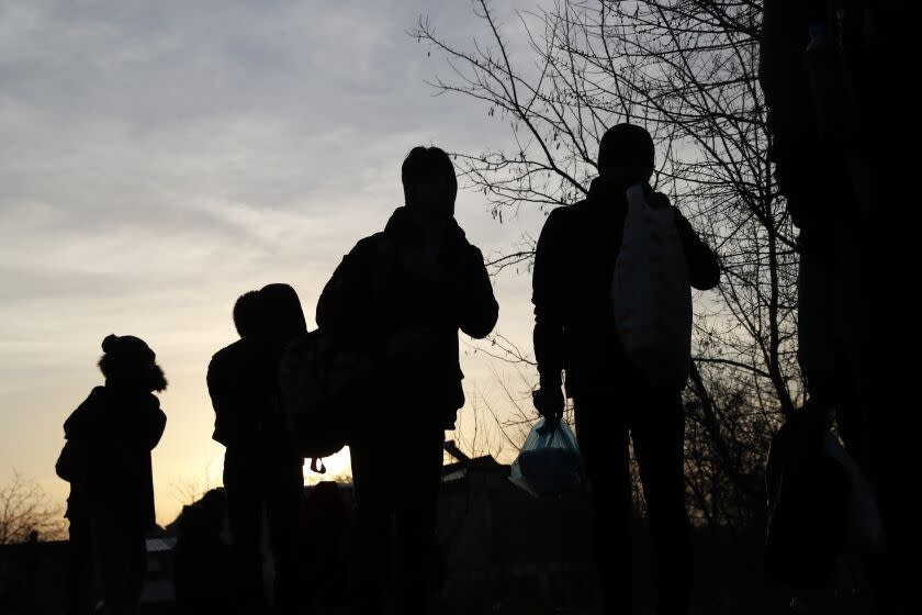 Migrants walk in Edirne, Turkey, near Turkish-Greek border on Wednesday, March 4, 2020. Facing a potential wave of nearly a million people fleeing fighting in northern Syria, Turkey has thrown open its borders with Greece to thousands of refugees and other migrants trying to enter Europe, and has threatened to send "millions" more. (AP Photo/Darko Bandic)