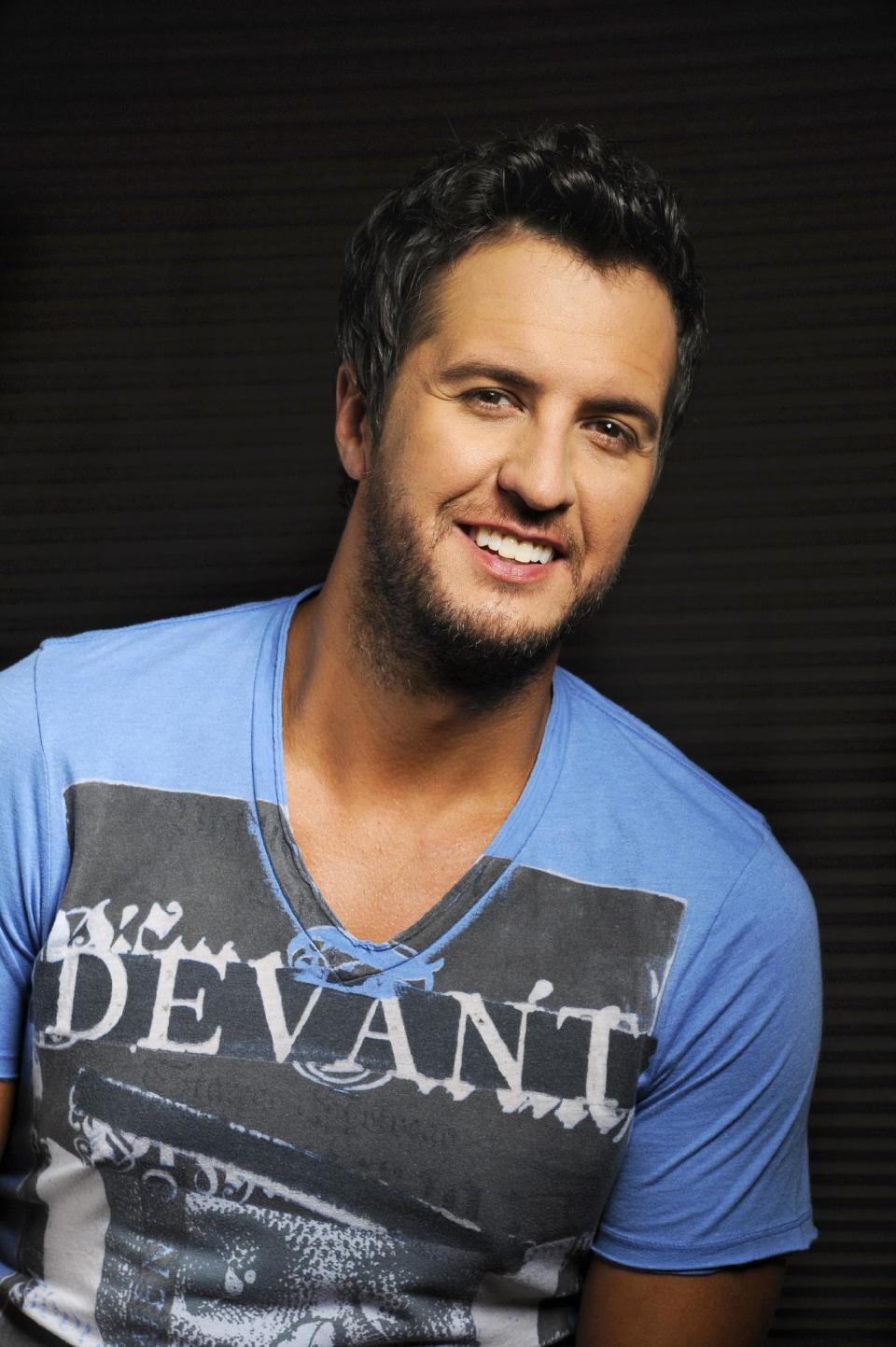 In this Tuesday, July 16, 2013 photo, Luke Bryan poses for a portrait at Audio Productions in Nashville, Tenn. Bryan has taken an unusual approach to the business side of his career since winning the Academy of Country Music's entertainer of the year in April: He's turning down almost everything. (Photo by Donn Jones/Invision/AP)