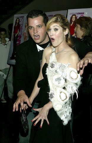 <p>Paul Hawthorne/Getty</p> Daniel Franzese and Lizzy Caplan in 2004