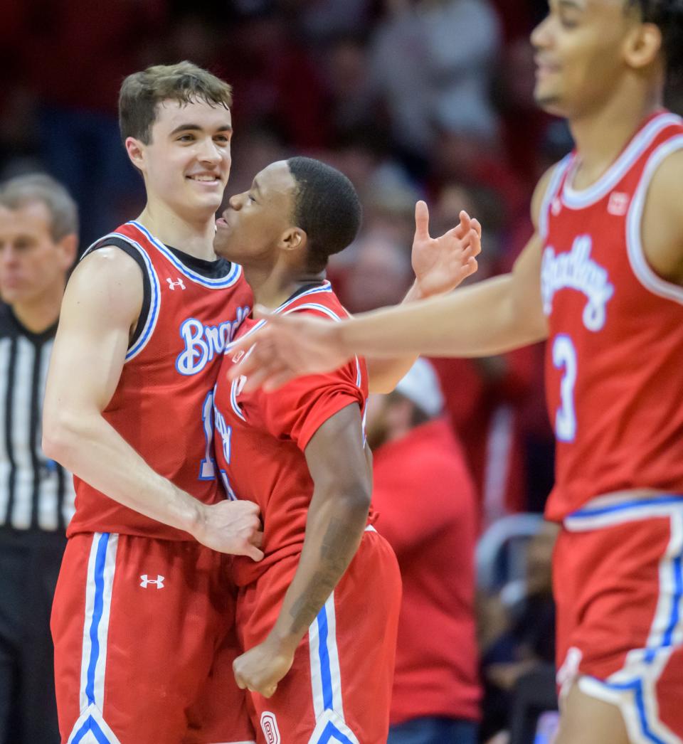 Bradley's Connor Hickman, left, and Duke Deen celebrate a Bradley score against Drake in the second half Sunday, Feb. 26, 2023 at Carver Arena. The Braves defeated the Bulldogs 73-61.