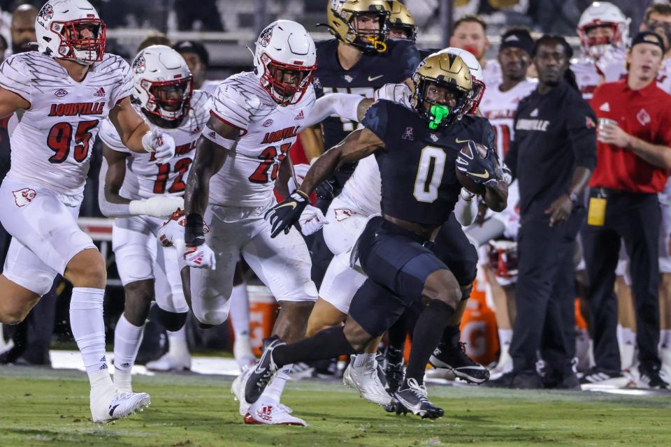 UCF Knights running back Johnny Richardson (0) carries the ball during the second quarter Friday, Sept. 9, 2022, against the Louisville Cardinals at FBC Mortgage Stadium in Orlando, Florida.