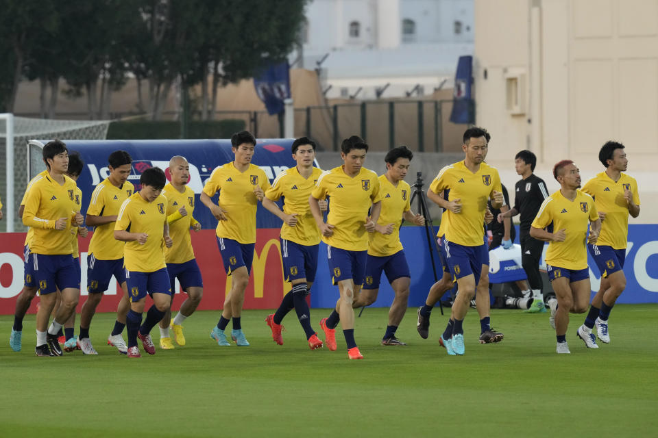 Players warm up during Japan official training on the eve of the World Cup round of 16 soccer match between Japan and Croatia at the in Doha, Qatar, Sunday, Dec. 4, 2022. (AP Photo/Eugene Hoshiko)