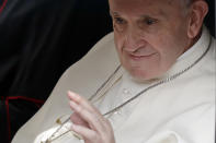 Pope Francis waves from a car as he leaves Dublin Castle at the end of his meeting with Irish Prime Minister Leo Varadkar, in Dublin, Ireland, Saturday, Aug. 25, 2018. Pope Francis is on a two-day visit to Ireland. (AP Photo/Matt Dunham)