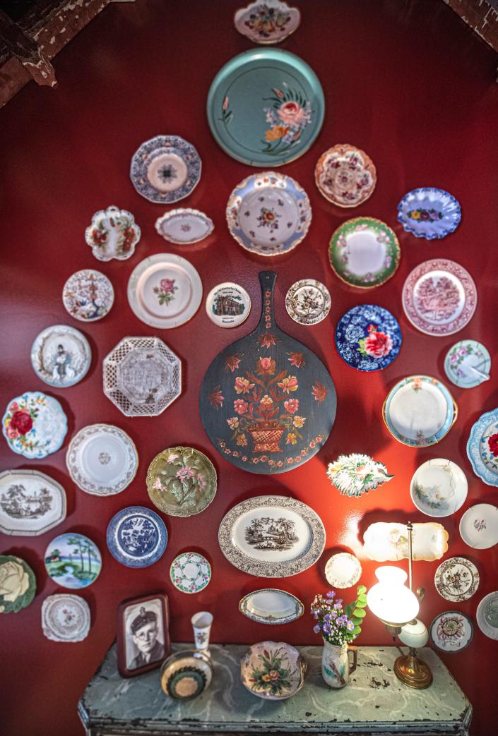 A wall of plates in the Shutt home. June 22, 2022