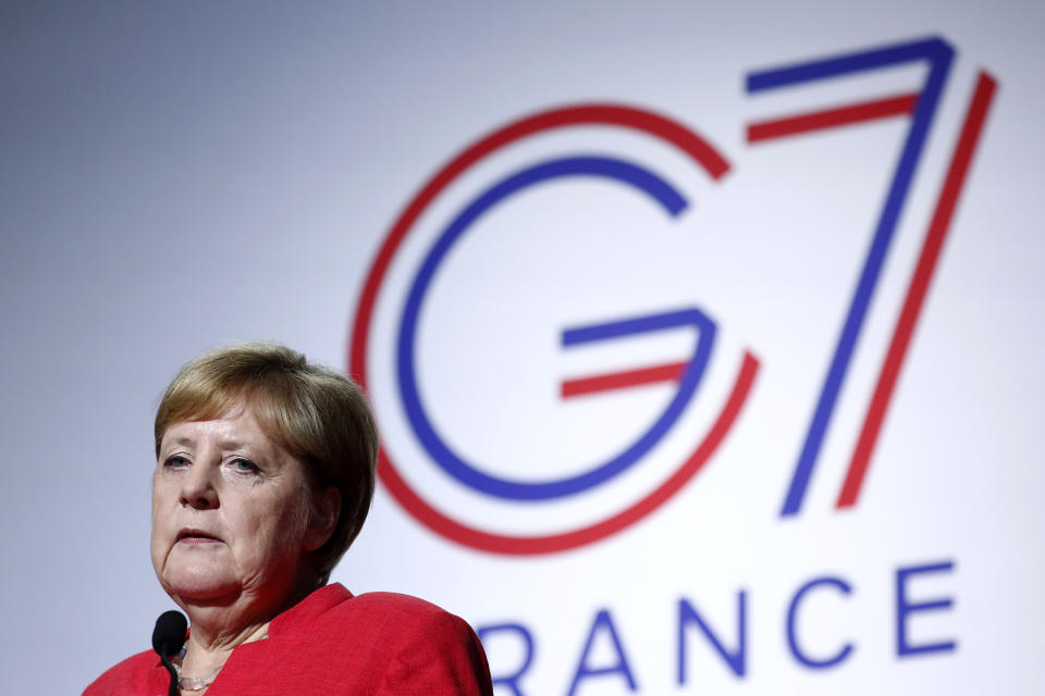 German Chancellor Angela Merkel attend a press conference on the situation in Sahel during the G7 summit in Biarritz, southwestern France, Sunday Aug. 25 2019. A top Iranian official paid an unannounced visit Sunday to the G-7 summit and headed straight to the building where leaders of the world's major democracies have been debating how to handle the country's nuclear ambitions. (Ian Langsdon Pool via AP)