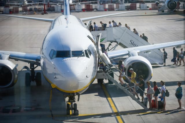 Passengers seen boarding Ryanair aircraft Boeing 737-800 at...