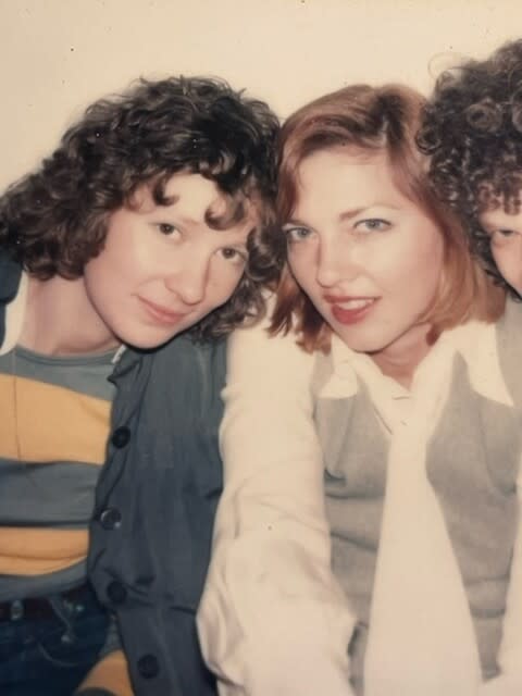 Two young women pose for a photograph.