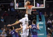 Dec 2, 2018; Charlotte, NC, USA; New Orleans Pelicans forward center Anthony Davis (23) drives past Charlotte Hornets guard forward Jeremy Lamb (3) and forward Frank Kaminsky (44) during the second half at the Spectrum Center. Pelicans won 119-109. Mandatory Credit: Sam Sharpe-USA TODAY Sports