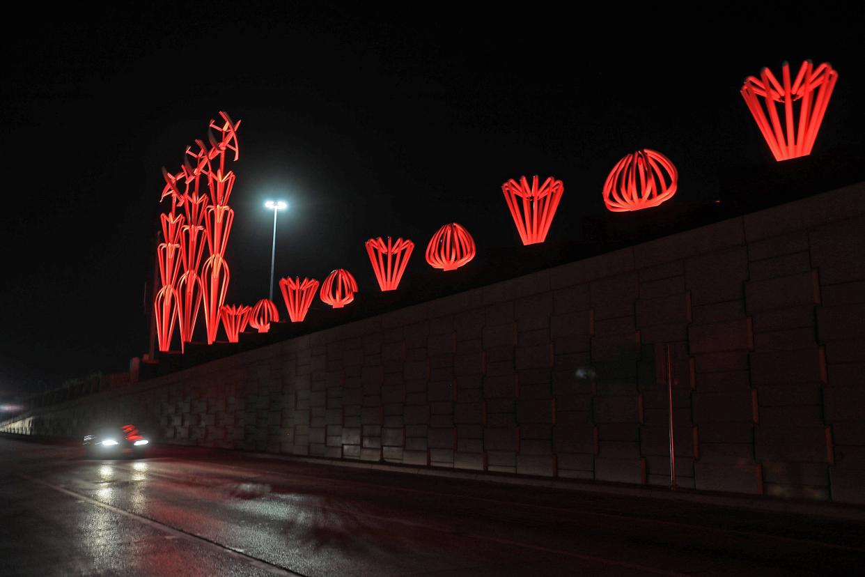 The sculpture at Interstate 10 and Airway Blvd. was illuminated in orange to remember the 23 victims of the massacre at Walmart.