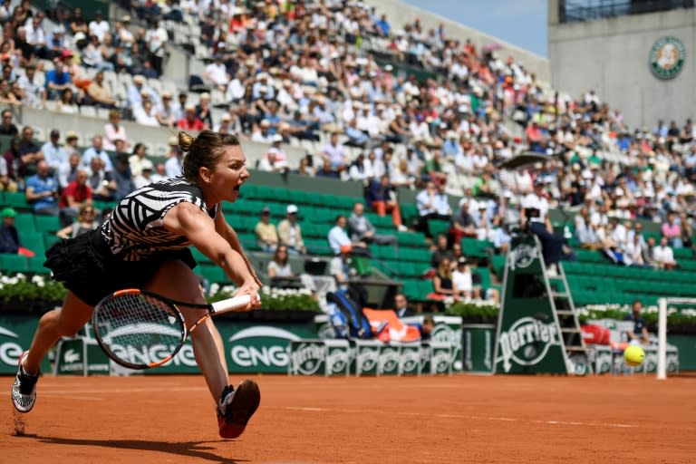 Romania's Simona Halep, a finalist at Roland Garros two years ago, struggled in three sets to make it to the last 16 in Paris on May 27, 2016