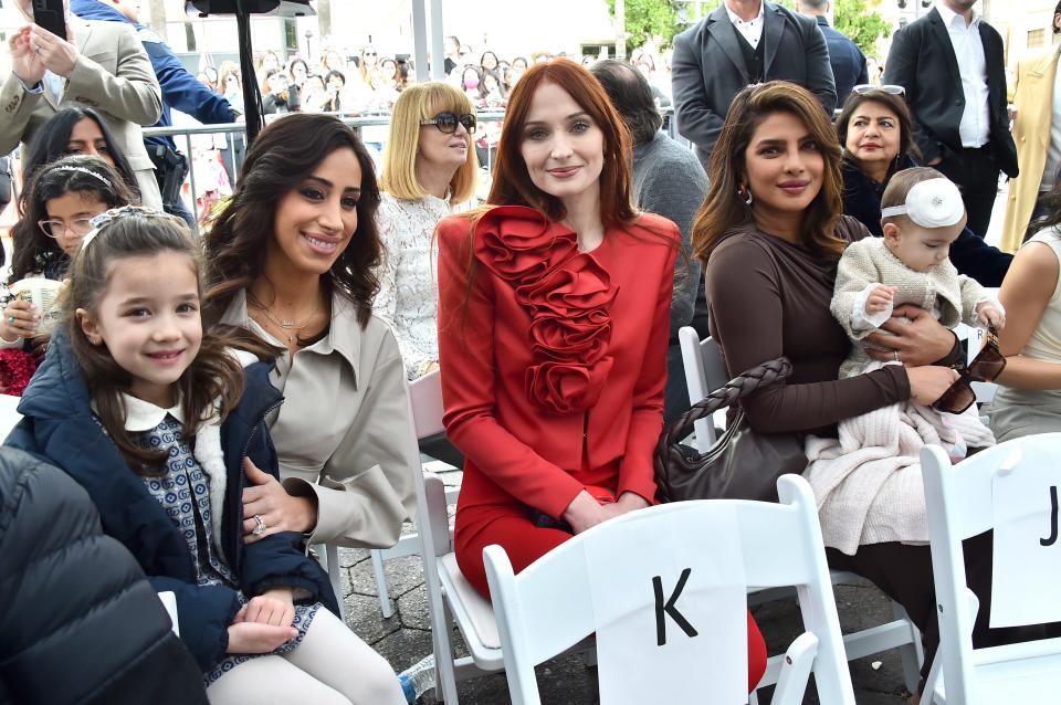 Valentina Angelina Jonas, from left, Danielle Jonas, Sophie Turner, Priyanka Chopra and Malti Marie Chopra Jonas attend a ceremony honoring The Jonas Brothers with a star on the Hollywood Walk of Fame, Monday, Jan. 30, 2023, in Los Angeles. (Photo by Jordan Strauss/Invision/AP) ORG XMIT: CAJS182