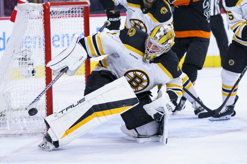 Boston Bruins' Jeremy Swayman makes the save during the second period of an NHL hockey game against the Philadelphia Flyers, Sunday, April 9, 2023, in Philadelphia. (AP Photo/Chris Szagola)