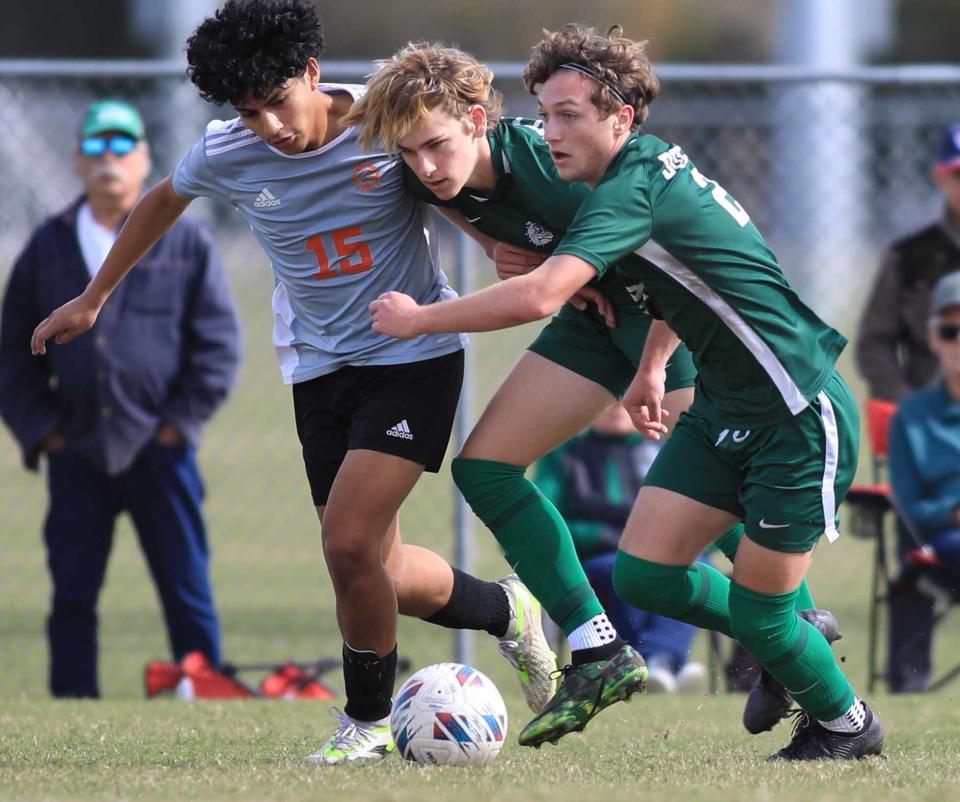 Flagler Palm Coast's Jack Moberly (24) and Chase Magee (10) help each other defend the ball during the Five Star Conference boys and girls soccer quarterfinals at Ormond Beach Sports Complex on Saturday, Jan.13th, 2024.