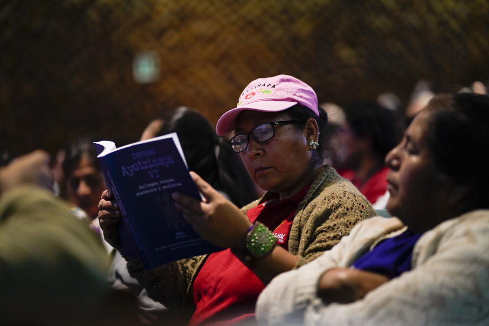A family member of the 43 missing students from Ayotzinapa attends a presentation of a report by the Interdisciplinary Group of Independent Experts (GIEI), in Mexico City, Tuesday, July 25, 2023. The GIEI presented its sixth report on the case of the missing students who disappeared on Sept. 26, 2014. (AP Photo/Eduardo Verdugo)