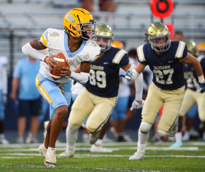 Cape Henlopen's Keishawn Mansfield (4) looks for running room in the second quarter of Salesianum's 28-21 season-opening win at Abessinio Stadium, Thursday, Sept. 1, 2022.
