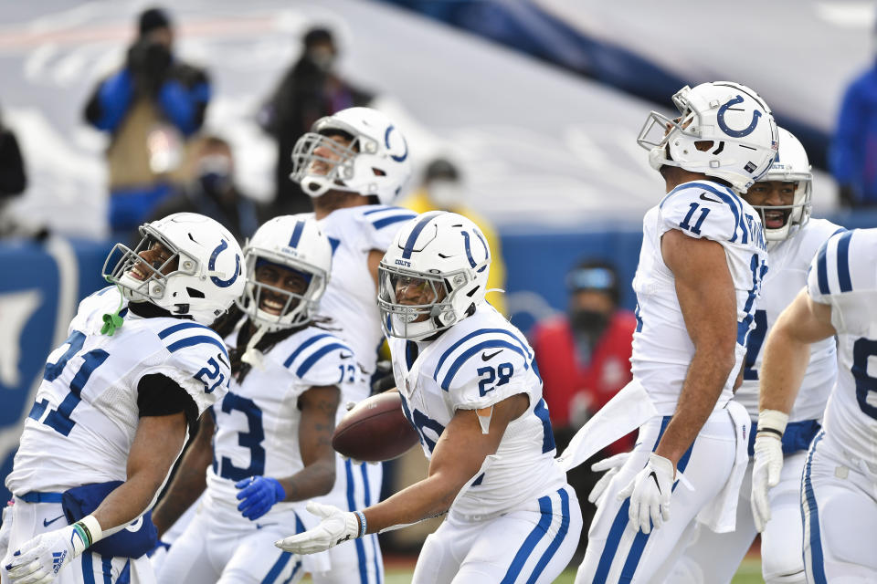 Indianapolis Colts running back Jonathan Taylor (28) celebrates with teammates after scoring a touchdown during the first half of an NFL wild-card playoff football game against the Buffalo Bills Saturday, Jan. 9, 2021, in Orchard Park, N.Y. (AP Photo/Adrian Kraus)