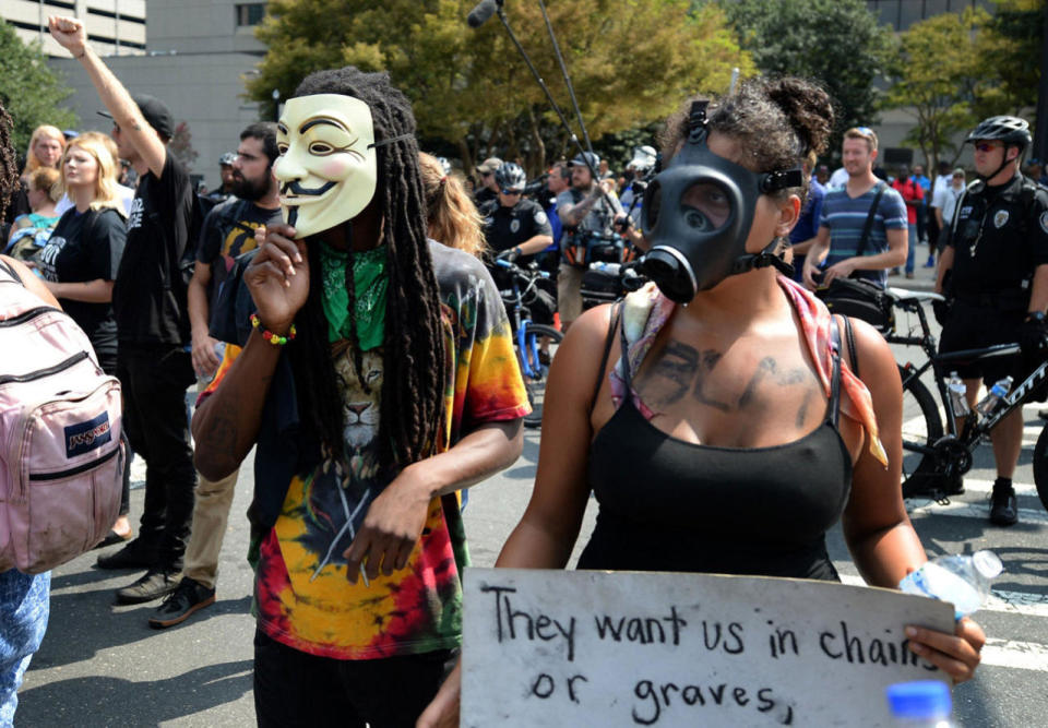 <p>Protesters stand outside Bank of America Stadium prior to an NFL football game between the Minnesota Vikings and the Carolina Panthers in Charlotte, N.C., Sunday, Sept. 25, 2016. (Jeff Siner/The Charlotte Observer via AP)</p>