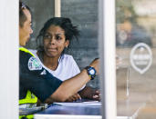 <p>An official, left, interviews a witness after a van plowed into a group of people on a Los Angeles sidewalk on Sunday, July 30, 2017. A witness to the crash told The Associated Press the van jumped a curb and careened into a group of people eating outside The Fish Spot restaurant in the city’s Mid-Wilshire neighborhood. (AP Photo/Damian Dovarganes) </p>