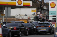 Drivers queue for fuel at a petrol station in London, Tuesday, Sept. 28, 2021. Long lines of vehicles have formed at many gas stations around Britain since Friday, causing spillover traffic jams on busy roads. (AP Photo/Frank Augstein)