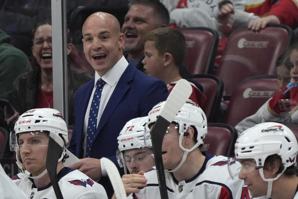 FILE - Washington Capitals head coach Spencer Carbery is shown during the first period of an NHL hockey game against the Florida Panthers, Saturday, Feb. 24, 2024, in Sunrise, Fla. Of the 16 teams entering the NHL playoffs this weekend, seven feature coaches who are in their first full year or hired as midseason replacements. In Washington, Carbery maintained a sense of calm and positivity to settle a Capitals team that endured numerous peaks and valleys -- and outscored by a 36-goal margin -- to secure the East’s eighth and final playoff spot. (AP Photo/Wilfredo Lee, File)