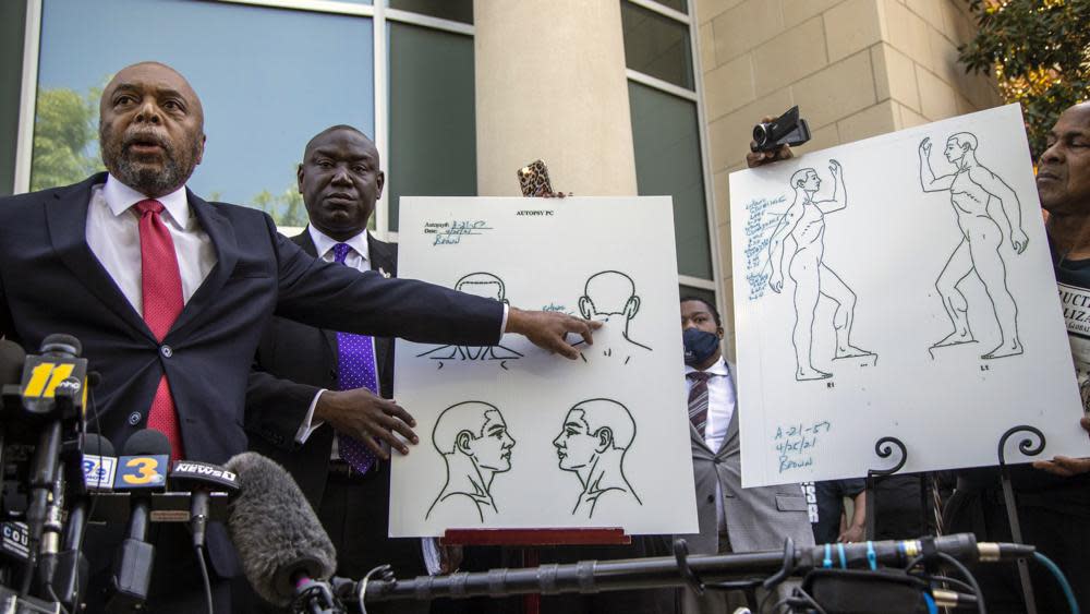 Attorneys for the family of Andrew Brown Jr., Wayne Kendall, left, and Ben Crump hold a news conference Tuesday, April 27, 2021. (Travis Long/The News & Observer via AP)