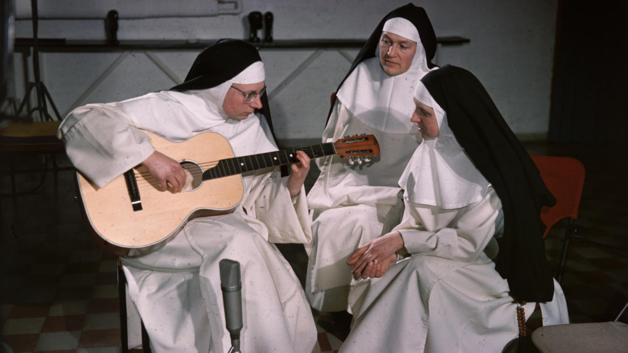  Sister Luc Gabrielle, 'The Singing Nun', practising with her chorus, following her top ten hit 'Dominique' 