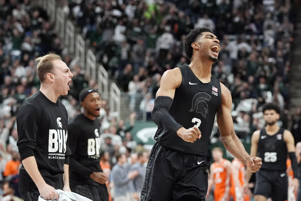 Michigan State guard Jaden Akins (3) reacts after a three-point basket during the first half of an NCAA college basketball game against Illinois, Saturday, Feb. 10, 2024, in East Lansing, Mich. (AP Photo/Carlos Osorio)