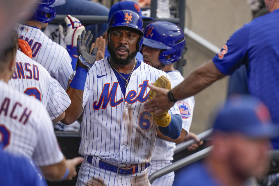 New York Mets' Starling Marte celebrates after scoring during the fifth inning of the baseball game against the Los Angeles Dodgers at Citi Field, Sunday, July 16, 2023, in New York. (AP Photo/Seth Wenig)