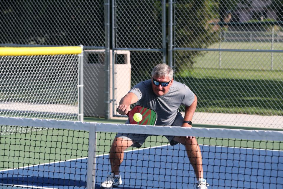 Wes Lindquist hits a shot during a pickleball volley at Manor Park in Aberdeen on June 30.