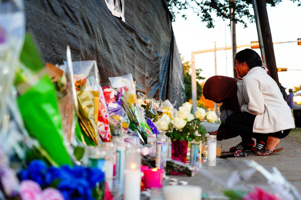 Visitors look at the memorial outside of the canceled Astroworld festival at NRG Park on November 7, 2021 in Houston, Texas. According to authorities, eight people died and 17 people were transported to local hospitals after what was described as a crowd surge at the Astroworld festival, a music festival started by Houston-native rapper and musician Travis Scott in 2018.