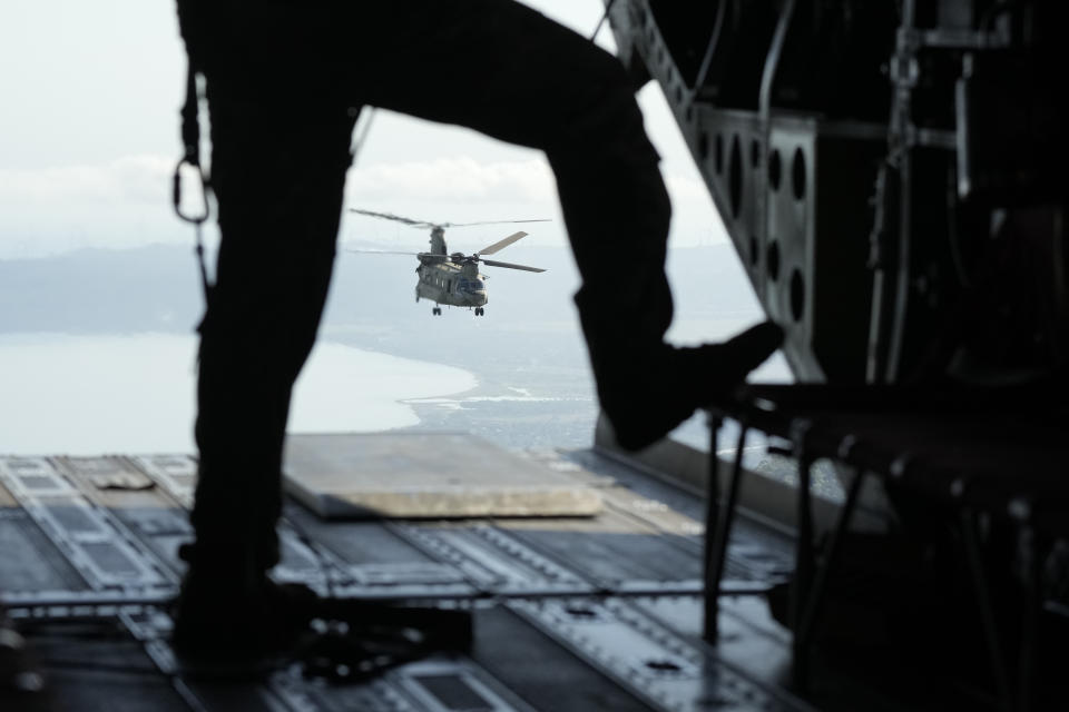 A U.S. Army CH-47 flies over Ilocos Norte province during a joint military exercise in northern Philippines on Monday, May 6, 2024. American and Filipino marines held annual combat-readiness exercises called Balikatan, Tagalog for shoulder-to-shoulder, in a show of allied battle readiness in the Philippines' northernmost island town of Itbayat along the strategic Bashi Channel off southern Taiwan. (AP Photo/Aaron Favila)