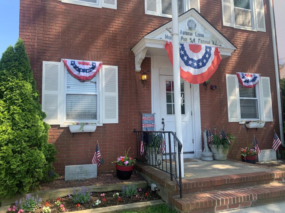 Freehold American Legion Post 54. The memorial to Walter Wrobleski is on the left; a marker on the right commemorates all those missing in action or prisoners of war.