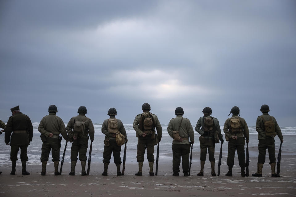 World War II reenactors gather on Omaha Beach in Saint-Laurent-sur-Mer, Normandy, France, Tuesday, June 6, 2023. The D-Day invasion that helped change the course of World War II was unprecedented in scale and audacity. Nearly 160,000 Allied troops landed on the shores of Normandy at dawn on June 6, 1944. (AP Photo/Thomas Padilla)