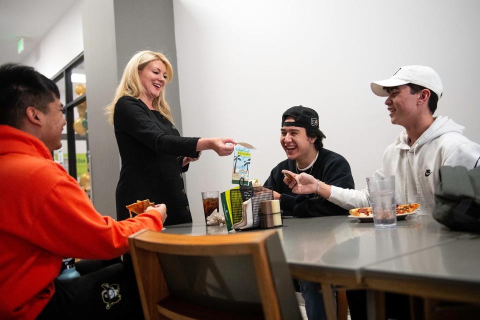 Colorado State University President Amy Parsons hands out stickers and chats with students at CSU in Fort Collins on Jan. 26.