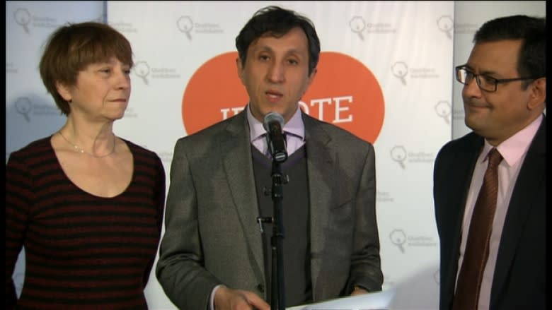 Quebec Solidaire MNA Amir Khadir, flanked by party spokespeople Francoise David and Andrés Fontecilla, at a press conference Saturday morning.