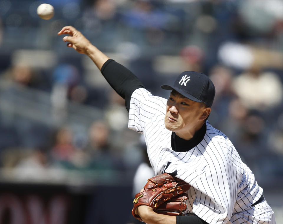 New York Yankees starting pitcher Masahiro Tanaka delivers in the third inning of Game 1 of an interleague baseball doubleheader against the Chicago Cubs at Yankee Stadium in New York, Wednesday, April 16, 2014. (AP Photo/Kathy Willens)