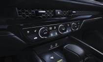 <p>The air vents hide behind honeycomb-style trim, which is a feature of the new Civic and CR-V as well.</p>