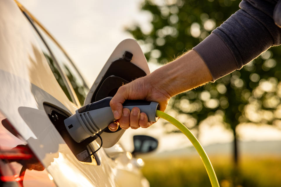 Person charging an electric car