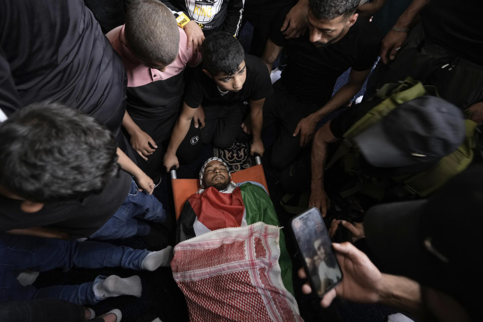 Mourners carry the body of Palestinian militant Abdullah Abu Hamdan, 24, during his funeral in the Balata refugee camp near the West Bank town of Nablus Monday, May 22, 2023. The Israeli military raided the camp early Monday, sparking a firefight that killed Abu Hamdan and two other Palestinian militants. (AP Photo/Majdi Mohammed)