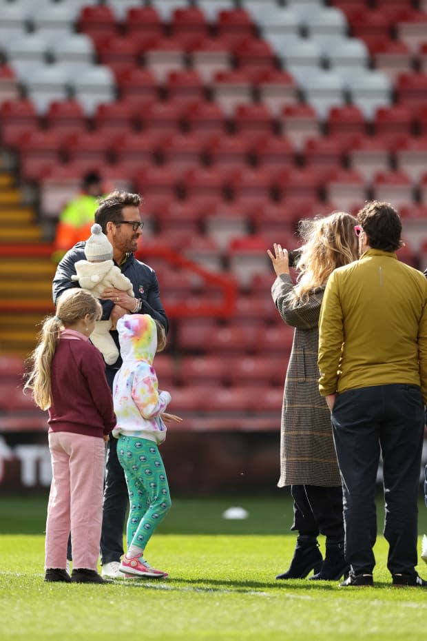 WREXHAM, WALES - MARCH 25: Wrexham co-owner Ryan Reynolds has his picture taken by his wife Blake Lively prior to the Vanarama National League match between Wrexham and York City at the Racecourse Ground on March 25, 2023 in Wrexham, Wales. (Photo by Matthew Ashton - AMA/Getty Images)<p><a href="https://www.gettyimages.com/detail/1249427712" rel="nofollow noopener" target="_blank" data-ylk="slk:Matthew Ashton - AMA/Getty Images;elm:context_link;itc:0;sec:content-canvas" class="link ">Matthew Ashton - AMA/Getty Images</a></p>