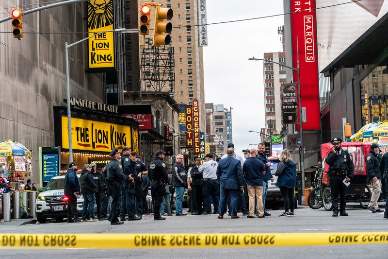 New York City police officers stand guard after a shooting incident in Times Square, New York