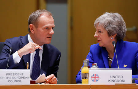 British Prime Minister Theresa May (R) and European Union Council President Donald Tusk during the extraordinary EU leaders summit to finalise and formalise the Brexit agreement in Brussels, Belgium November 25, 2018. Olivier Hoslet/Pool via REUTERS