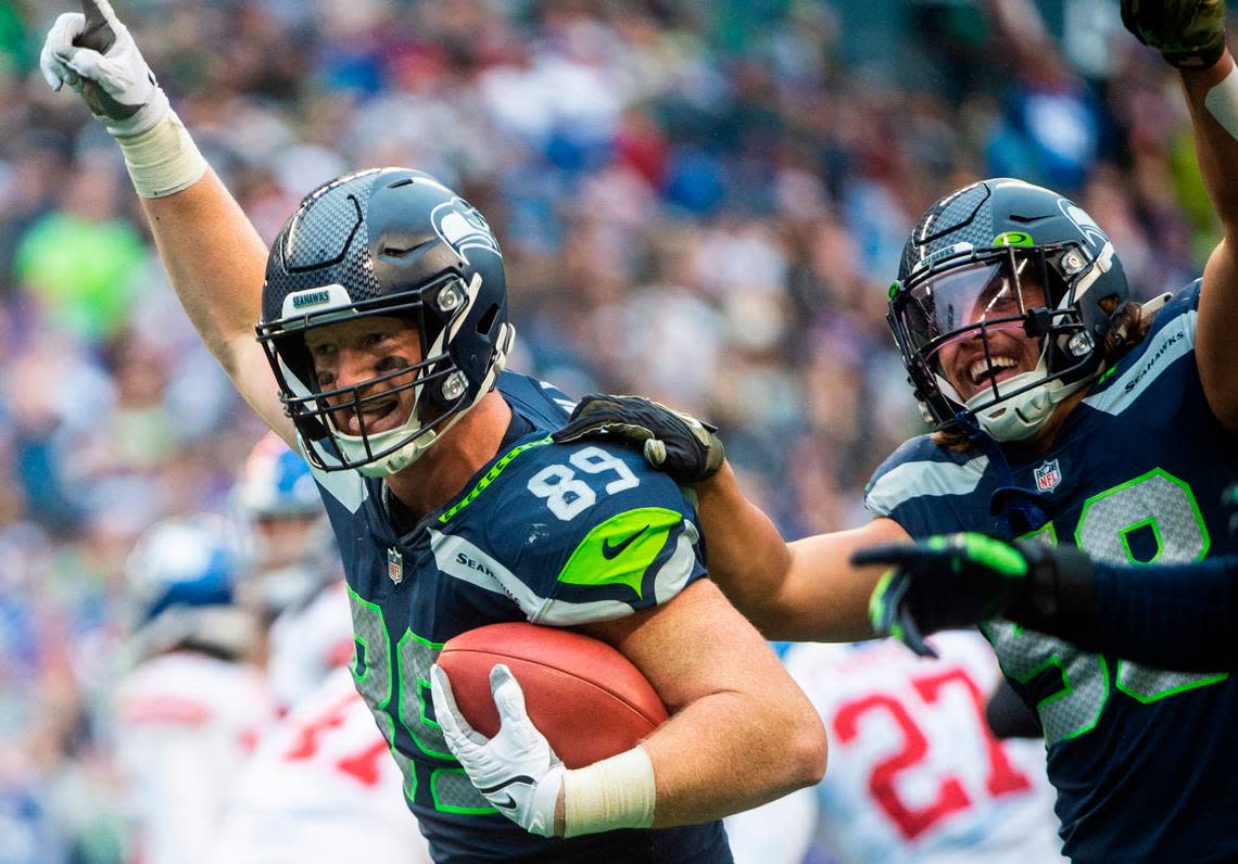 Seattle Seahawks tight end Will Dissly (89) celebrates after intercepting the ball in the fourth quarter of an NFL game at Lumen Field in Seattle, Wash. on Oct. 30, 2022. The Seahawks defeated the Giants 27-13. Cheyenne Boone/Cheyenne Boone/The News Tribune