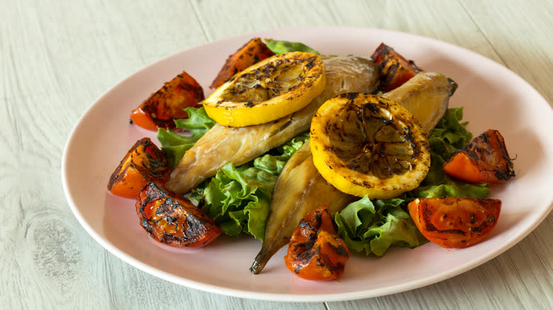 Smoked fillet with charred lemon garnish