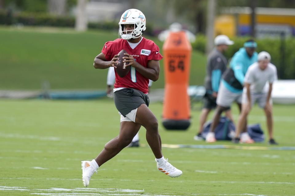 Miami Dolphins quarterback Tua Tagovailoa takes part in drills at the NFL football team's training camp, Wednesday, July 27, 2022, in Miami Gardens, Fla. (AP Photo/Lynne Sladky)