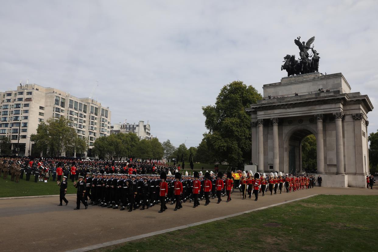 The State Gun Carriage carrying the coffin of Queen Elizabeth II arrives at Wellington Arch during the Ceremonial Procession following her State Funeral at Westminster Abbey, London.