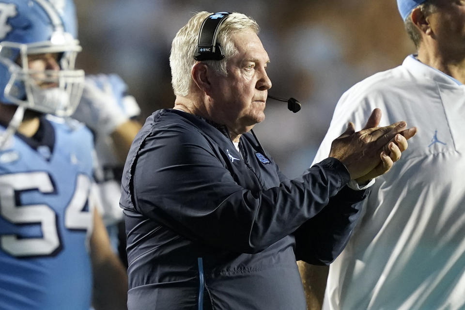 North Carolina coach Mack Brown applauds during the second half of the team's NCAA college football game against Virginia in Chapel Hill, N.C., Saturday, Sept. 18, 2021. (AP Photo/Gerry Broome)