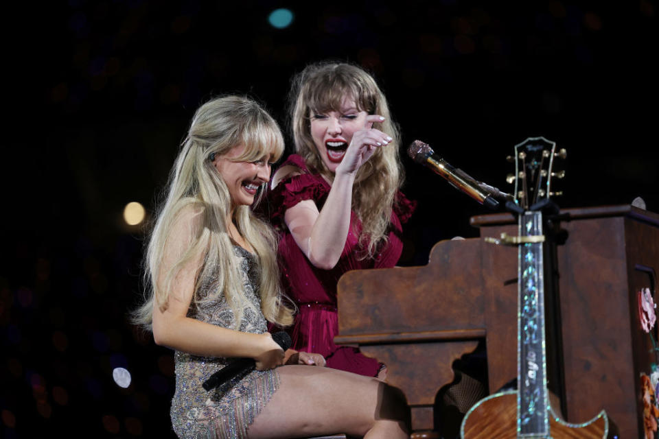 sabrina and taylor sitting together at a piano